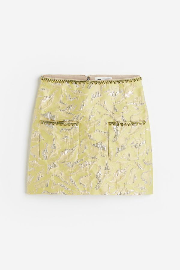 Falda línea A en tejido jacquard brillante