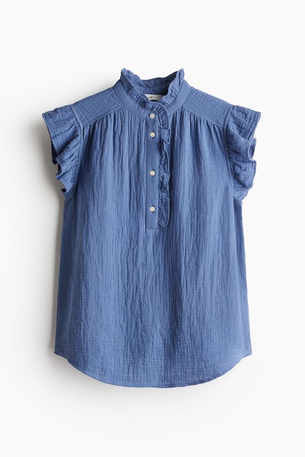 Blusa de muselina con manga sisa con volante