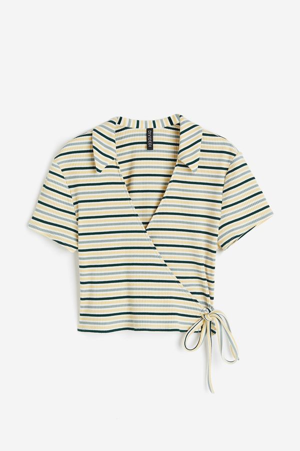 Blusa cruzada en punto acanalado