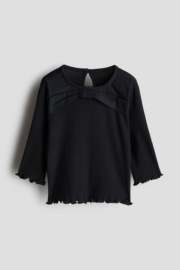 Blusa de punto con detalle de moño