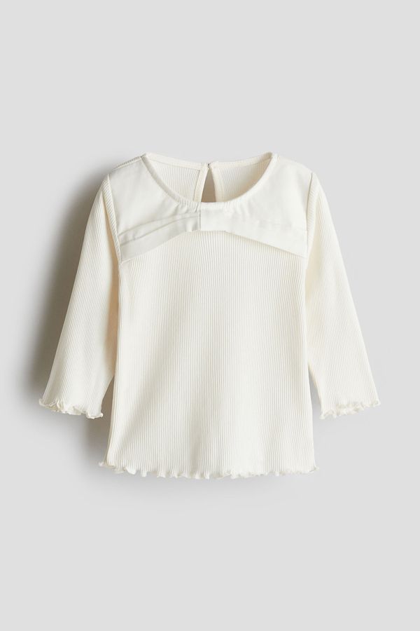 Blusa de punto con detalle de moño