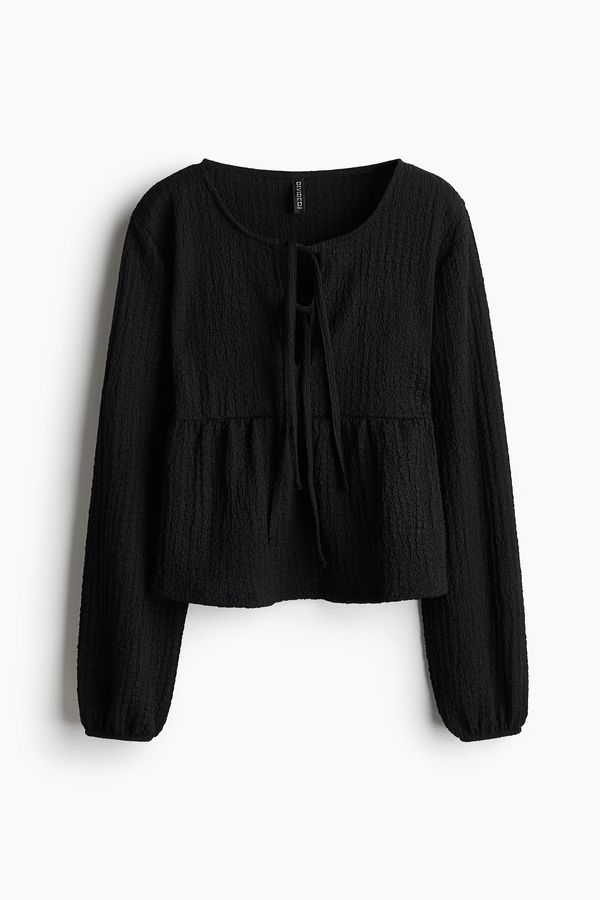 Blusa efecto arrugado con lazada