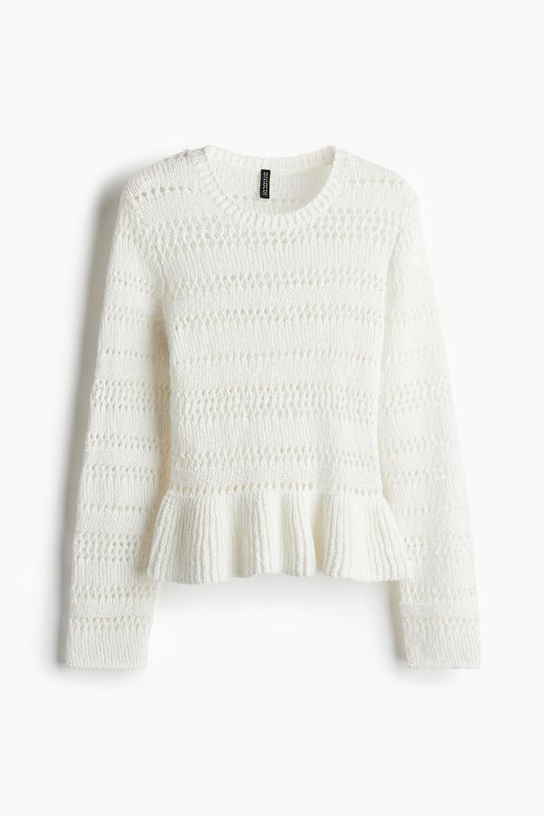 Saco en tejido pointelle con peplum
