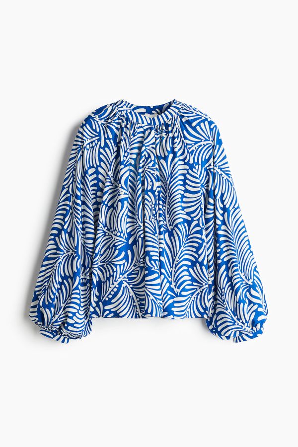 Blusa con mangas globo
