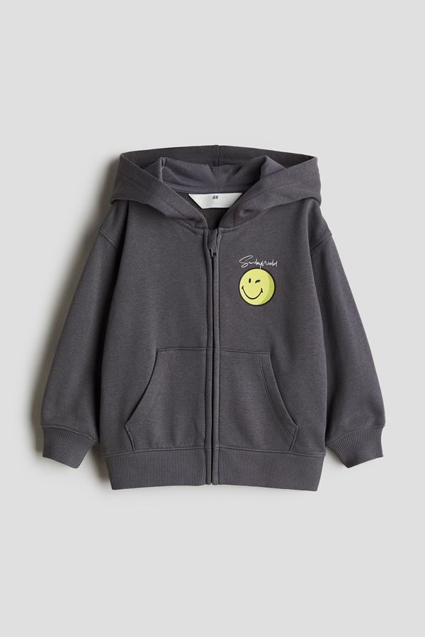 Hoodie con cremallera y motivos estampados