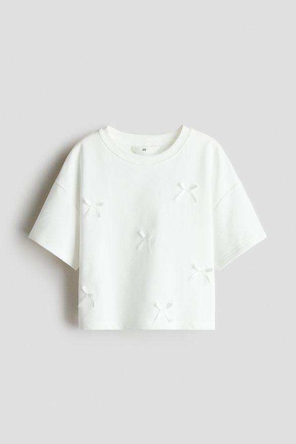 Camiseta corta con motivo estampado