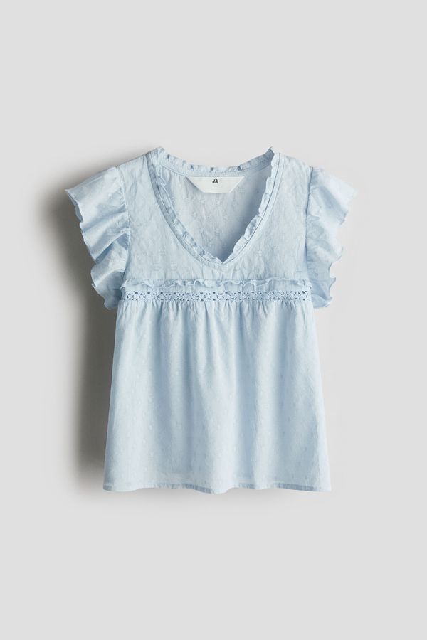 Blusa en algodón con ribetes de volante