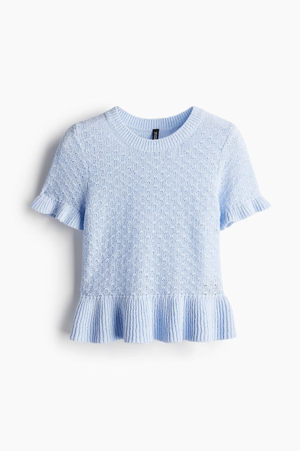 Blusa en tejido pointelle con ribetes de volante