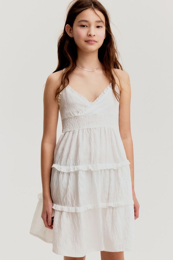 Vestido enresortado con volantes