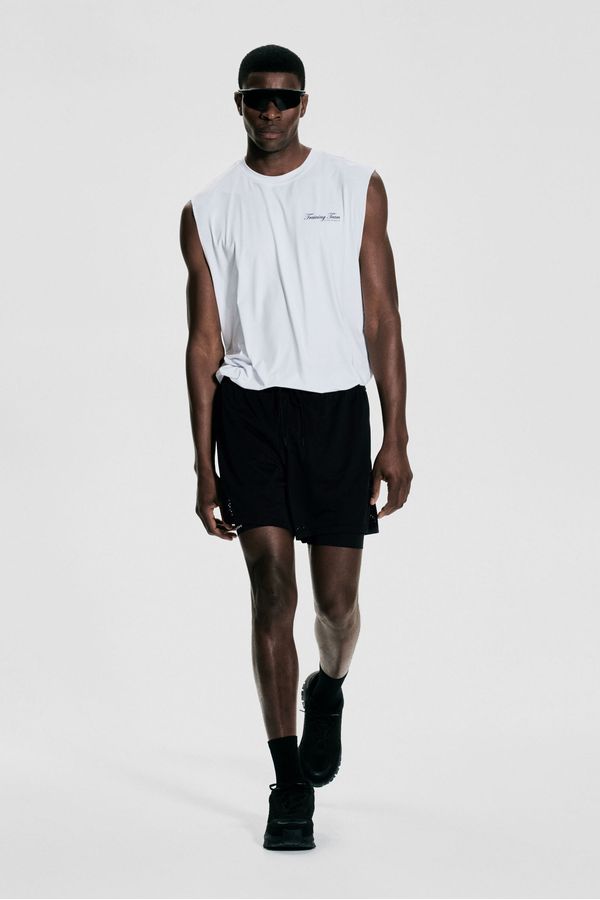 Shorts a media pierna 2 en 1 con DryMove™