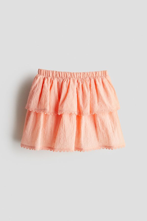 Falda short en algodón con diseño de volantes
