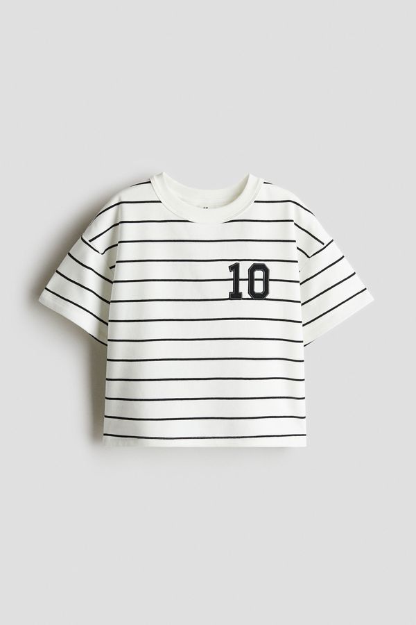 Camiseta corta con motivo estampado