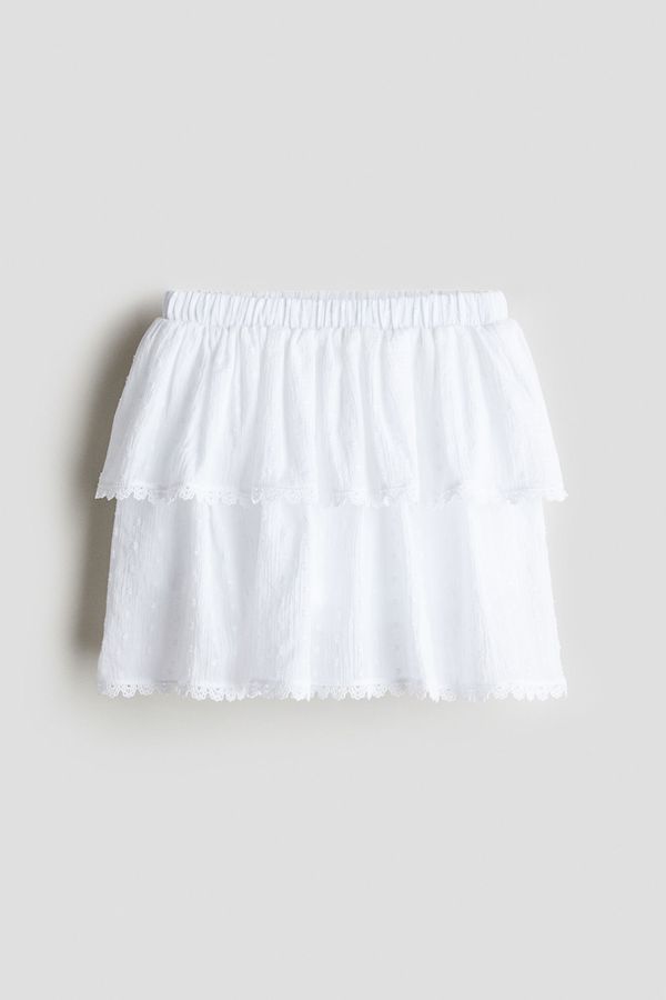 Falda short en algodón con diseño de volantes