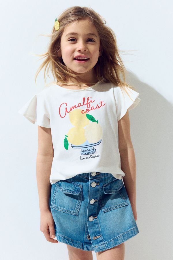 Camiseta en algodón con manga de volante