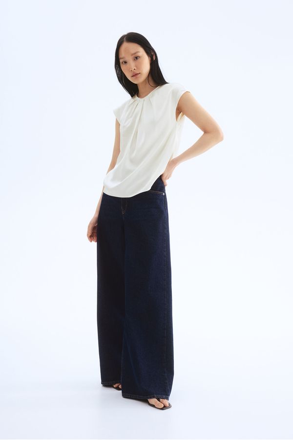 Blusa con pliegues