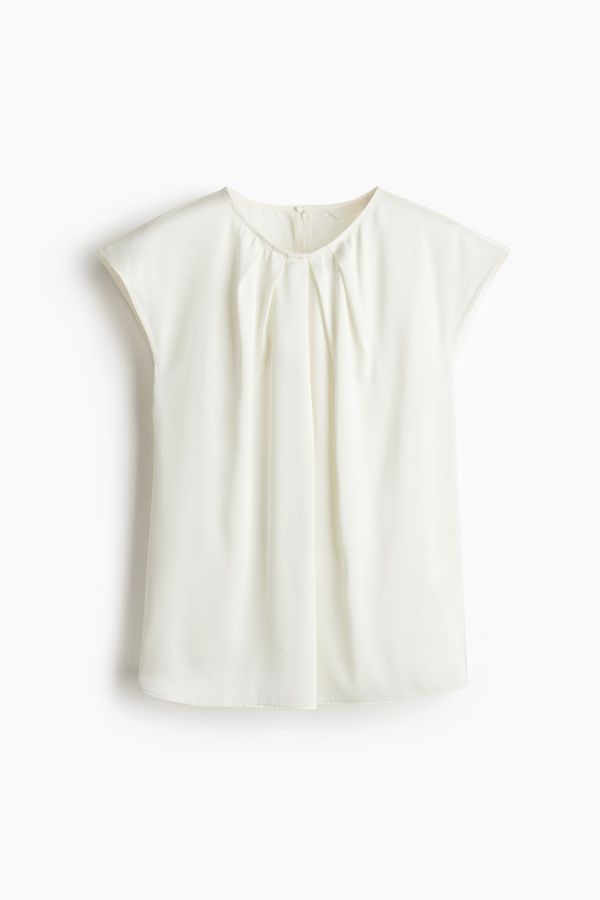Blusa con pliegues