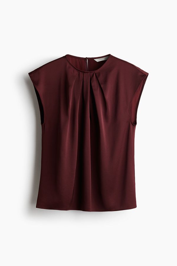 Blusa con pliegues