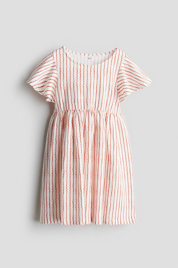 Vestido de algodón con manga sisa con volante