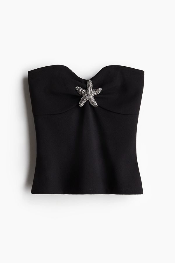 Blusa tubo con adorno de metal