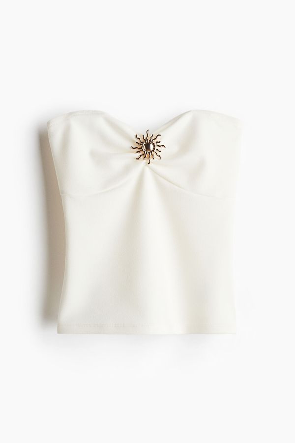 Blusa tubo con adorno de metal