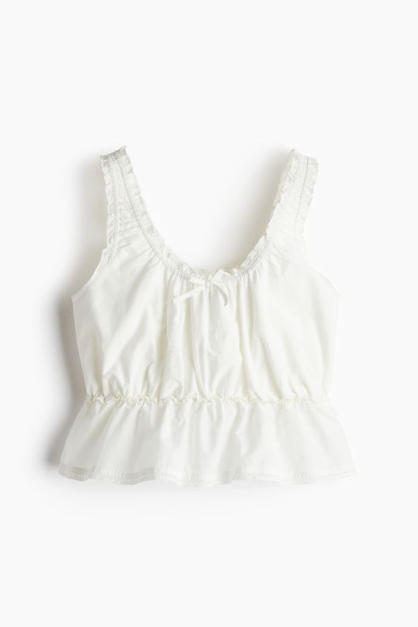 Blusa con fruncido y peplum