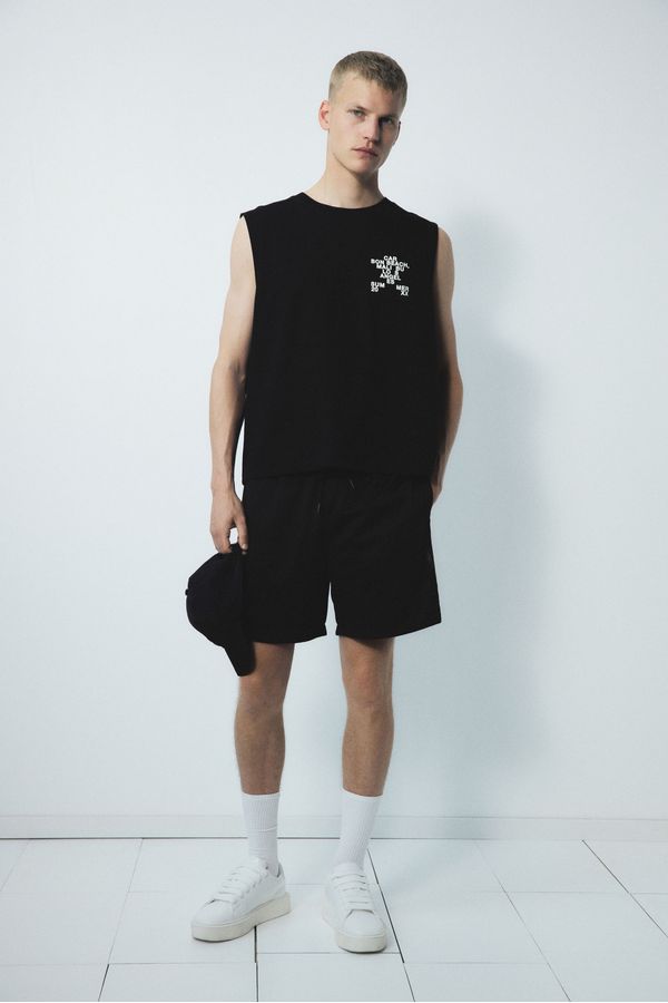 Camiseta manga sisa con motivo estampado Loose Fit