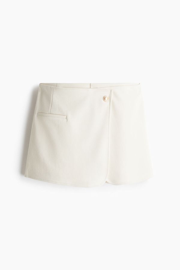 Falda short interlock