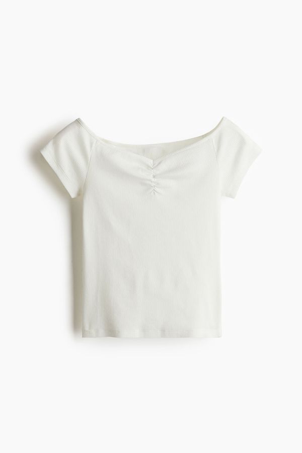 Blusa en punto acanalado con escote barco