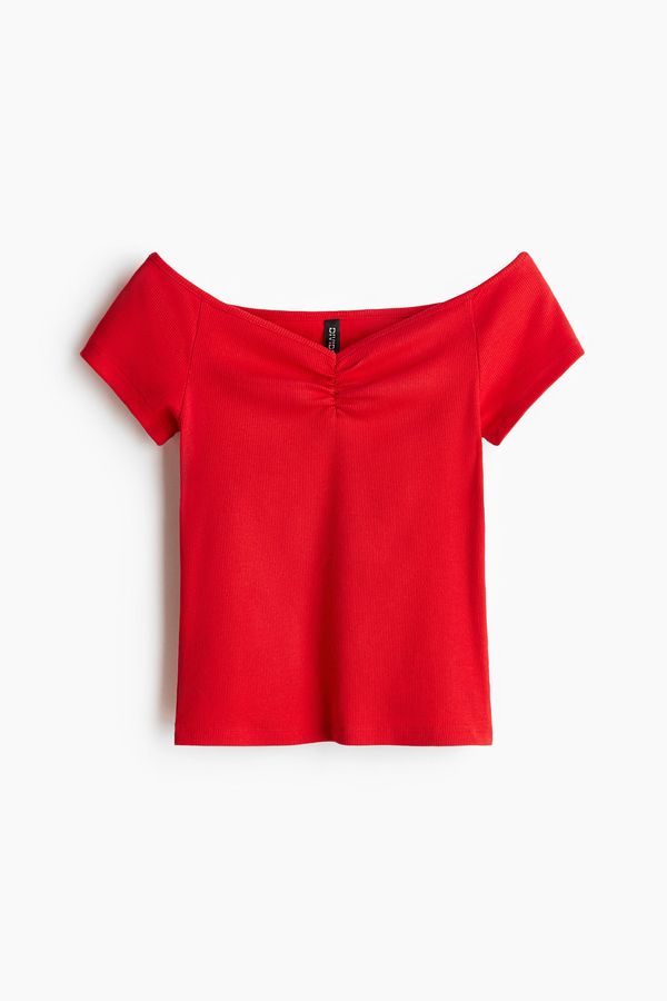 Blusa en punto acanalado con escote barco
