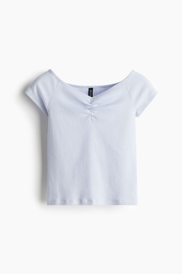 Blusa en punto acanalado con escote barco