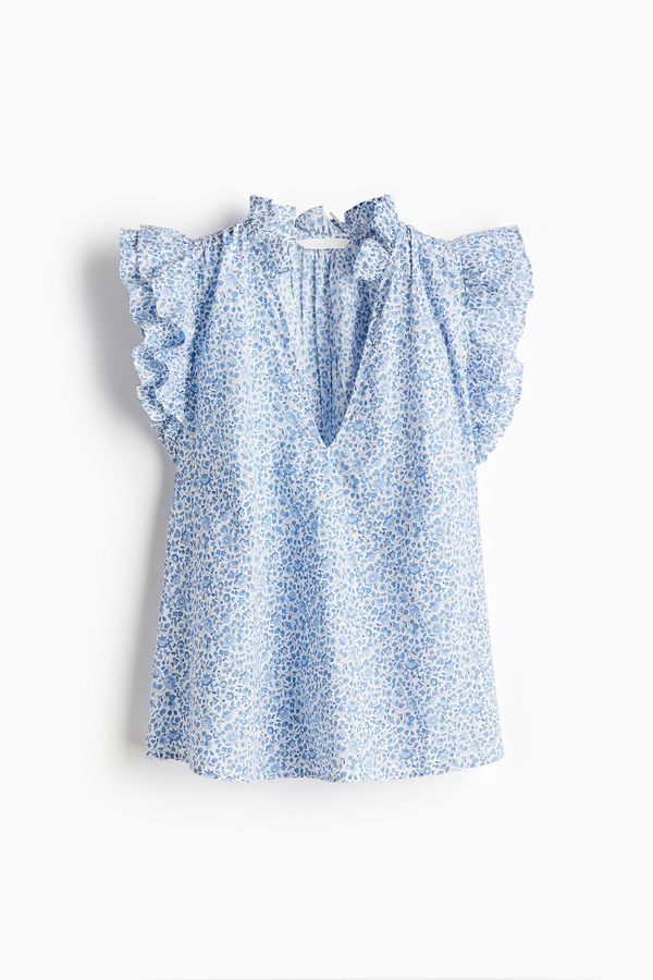 Blusa con ribetes de volante
