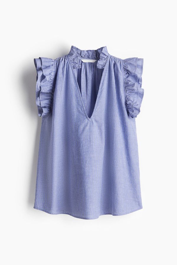 Blusa con ribetes de volante