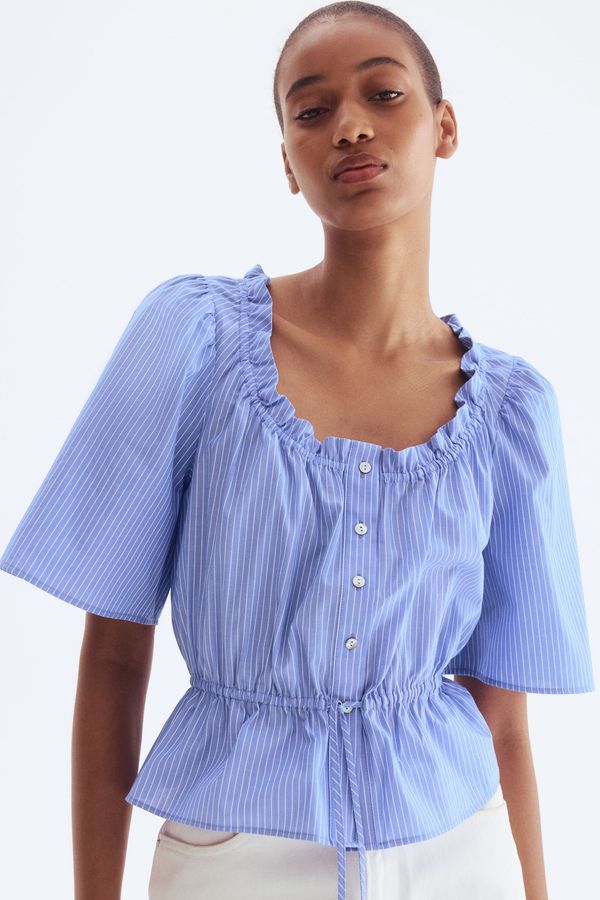 Blusa de algodón con ribetes de volante