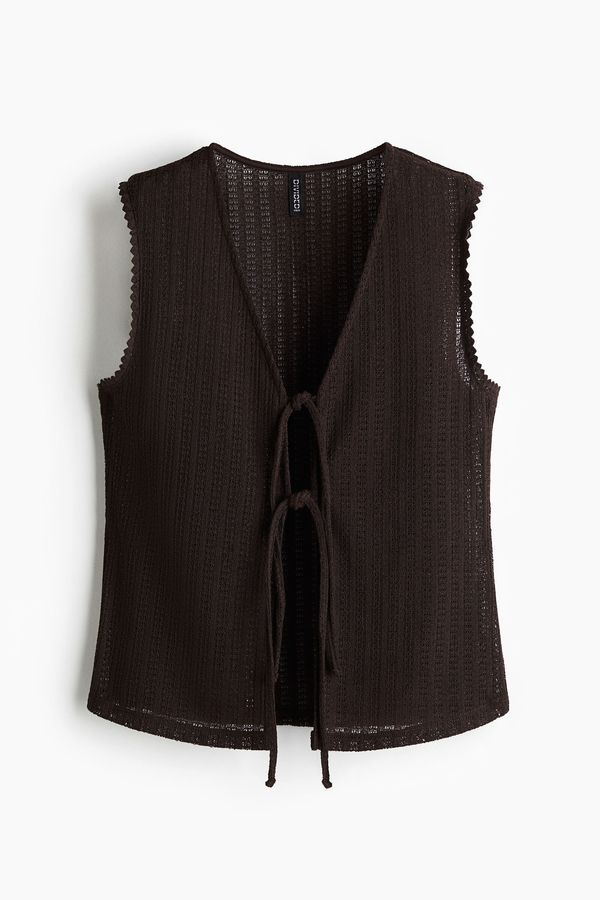 Blusa en tejido de punto con tiras de anudar