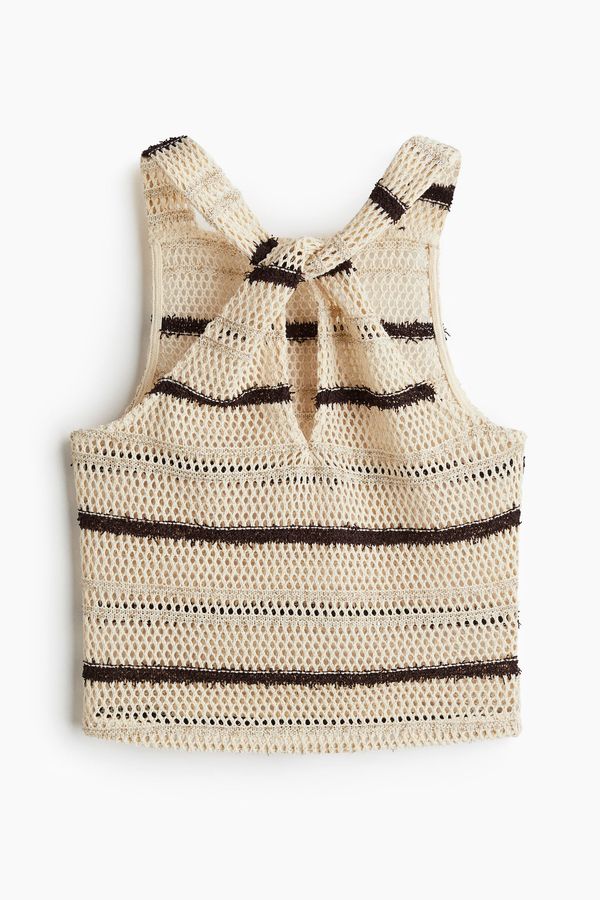 Blusa brillante en tejido calado