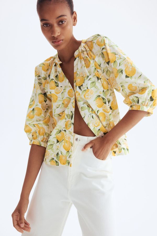 Blusa de popelina con mangas globo