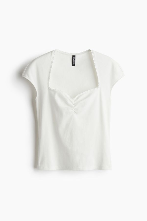 Blusa en punto acanalado con escote corazón