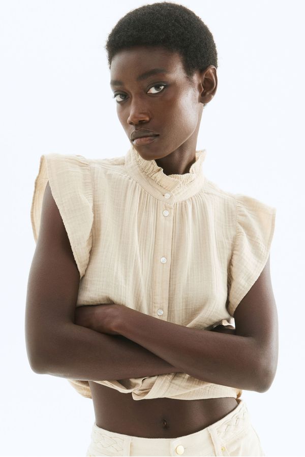 Blusa en muselina de manga sisa con volante