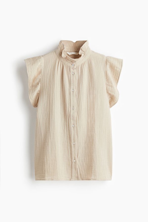 Blusa en muselina de manga sisa con volante