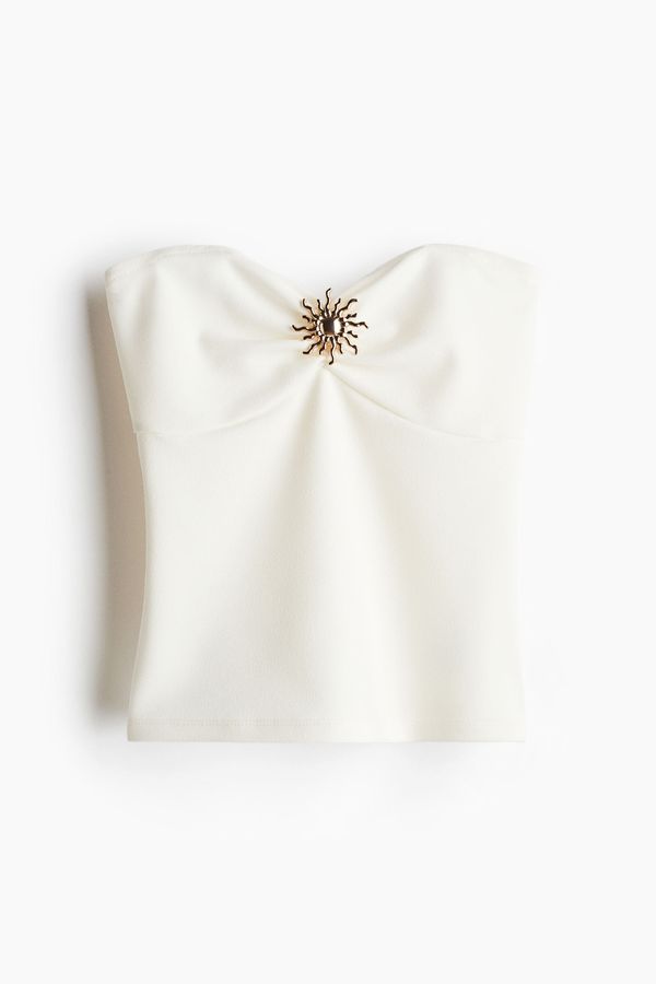 Blusa tubo con adorno de metal