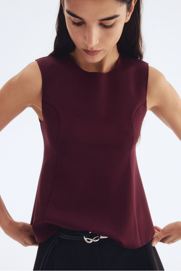 Blusa interlock con peplum