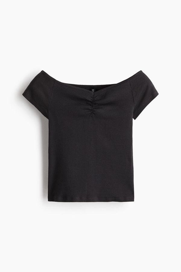 Blusa en punto acanalado con escote barco