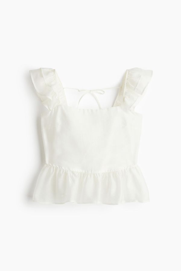 Blusa con lazada y peplum